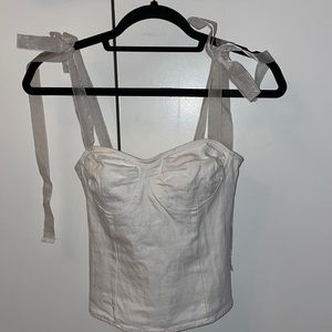 white fashion nova blouse with tie straps.